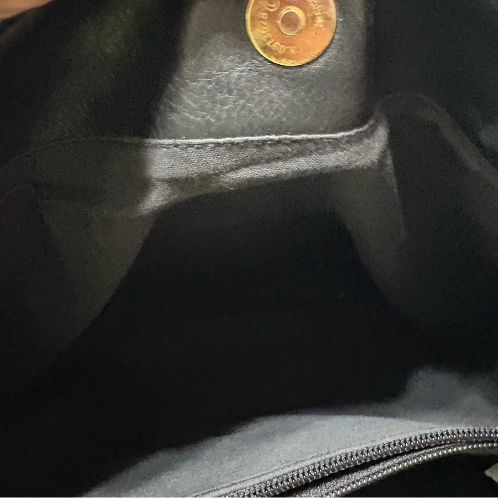 Black tote bag with a tassel accent. - Picture 7 of 12